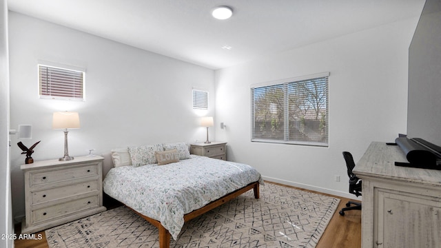 bedroom with light hardwood / wood-style flooring