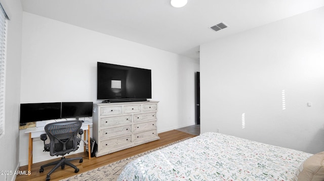 bedroom featuring light hardwood / wood-style flooring