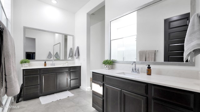 bathroom featuring tile patterned flooring and vanity