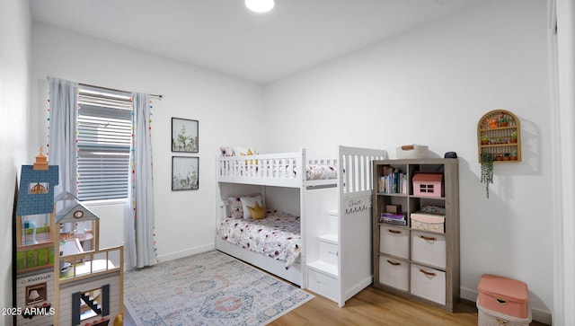 bedroom with light hardwood / wood-style flooring