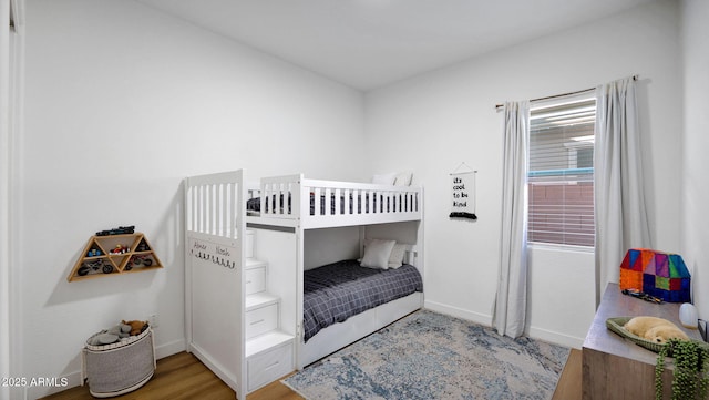 bedroom with wood-type flooring