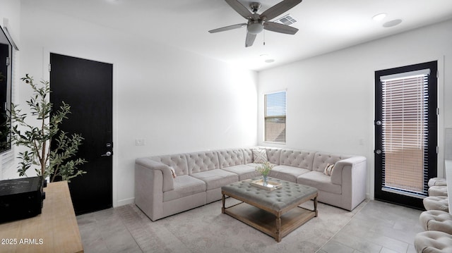 living room featuring ceiling fan