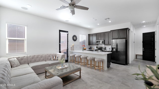 living room featuring ceiling fan