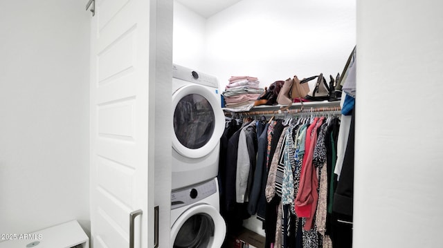 laundry room featuring stacked washer / dryer