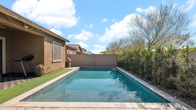 view of swimming pool featuring grilling area