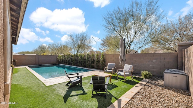 view of swimming pool featuring a lawn