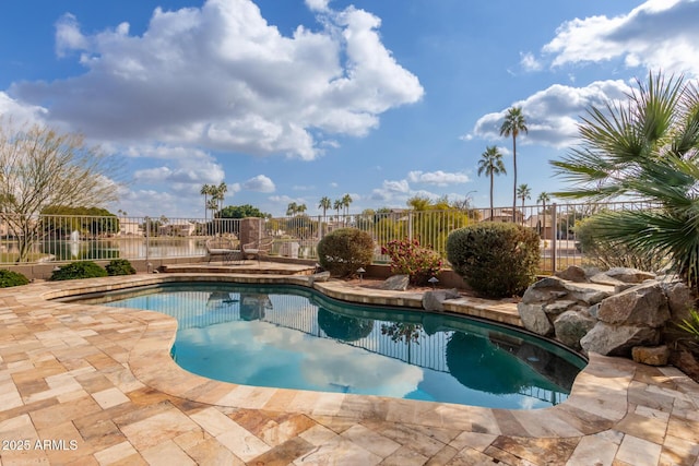 view of swimming pool with a patio area