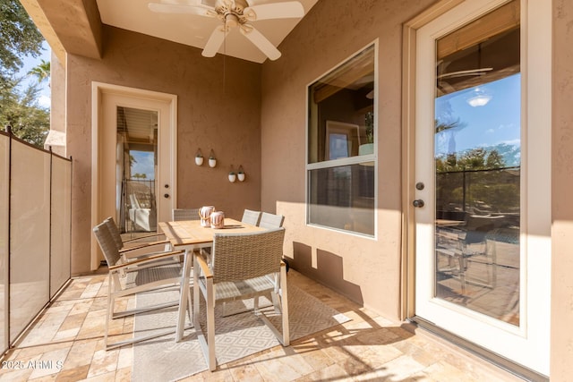 exterior space featuring ceiling fan