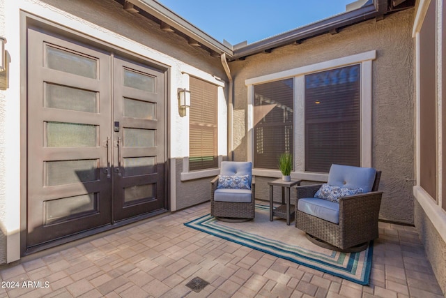 doorway to property featuring a patio and french doors