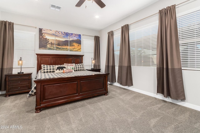 bedroom with light carpet and ceiling fan