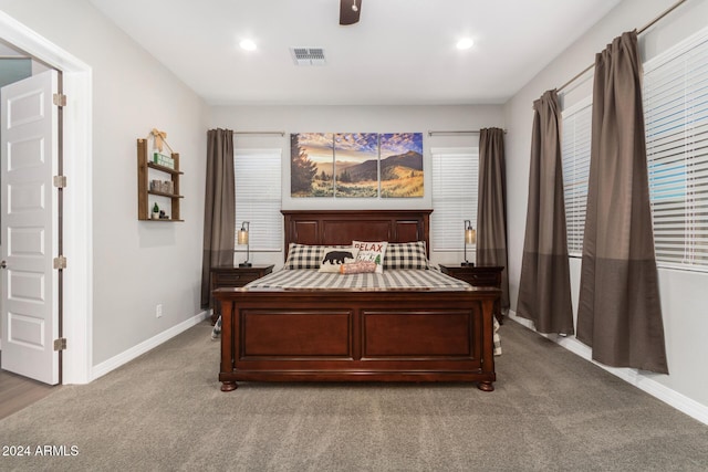 bedroom featuring ceiling fan and light colored carpet