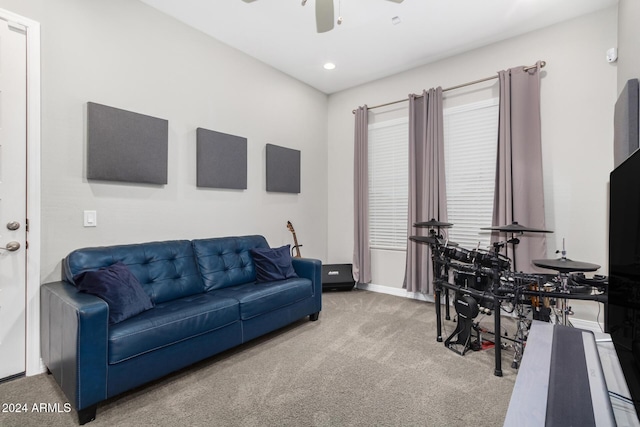 living room with light carpet and ceiling fan