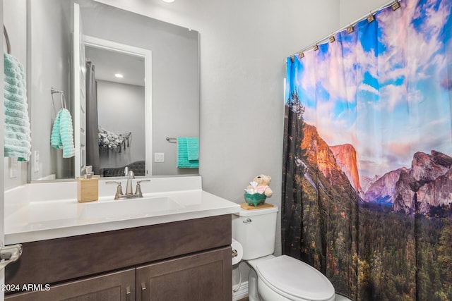 bathroom featuring vanity and toilet