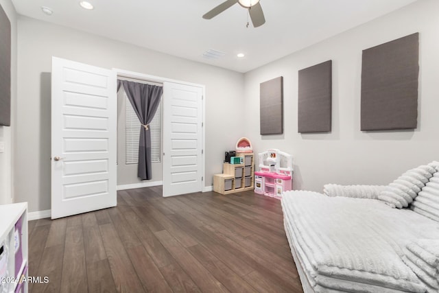 sitting room with ceiling fan and dark hardwood / wood-style floors