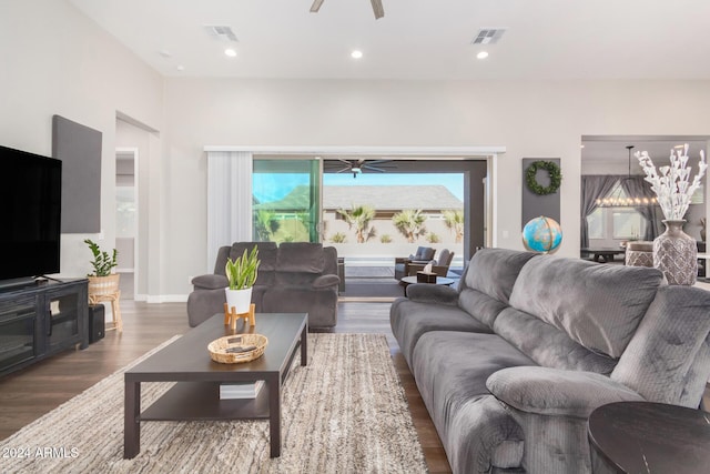 living room with ceiling fan and hardwood / wood-style floors