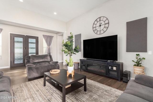 living room with french doors and dark wood-type flooring