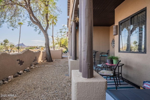 view of patio / terrace featuring fence