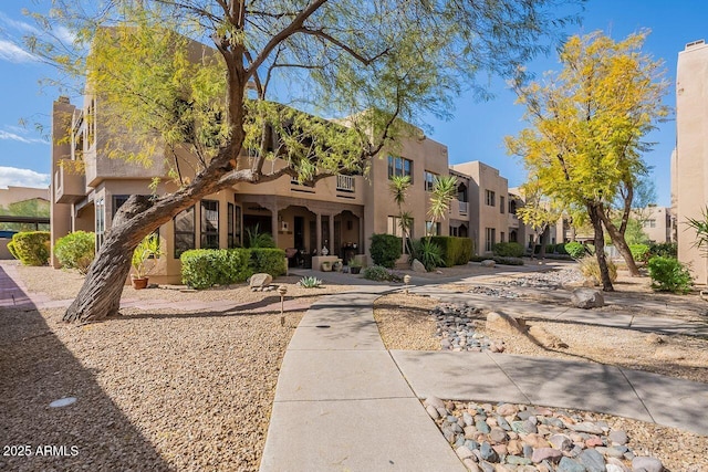 pueblo-style home featuring a residential view