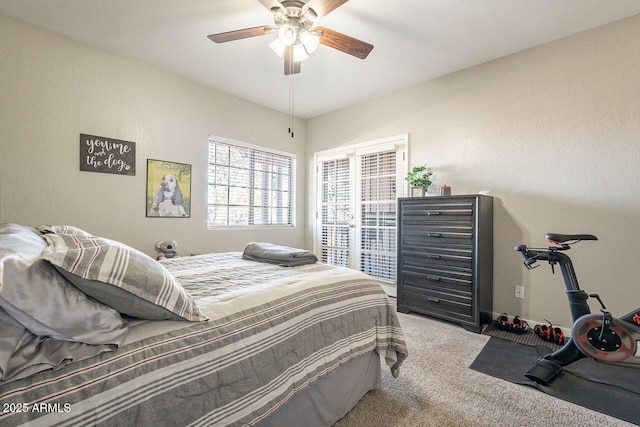 bedroom with a ceiling fan and carpet floors