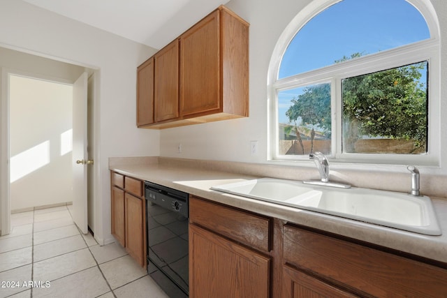 kitchen with dishwasher, light tile patterned flooring, and sink