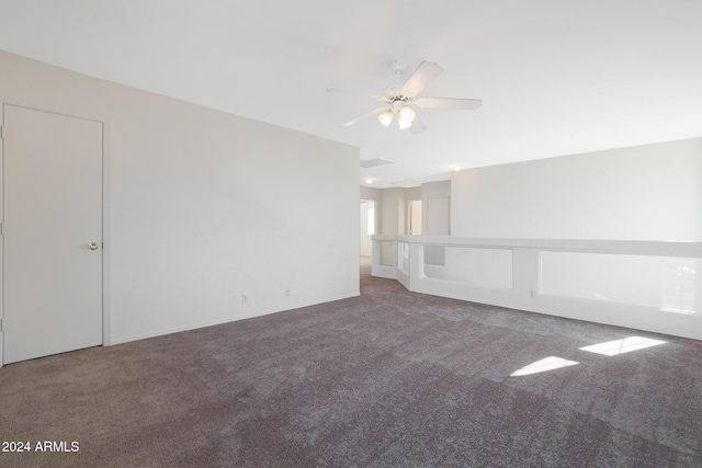 empty room featuring carpet flooring and ceiling fan