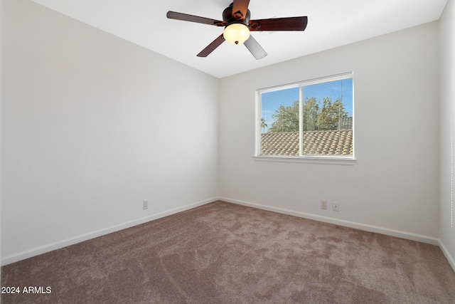 empty room with carpet flooring and ceiling fan