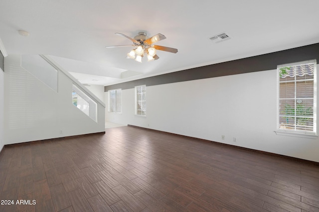 interior space with ceiling fan and dark wood-type flooring