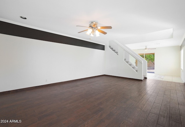 unfurnished living room with dark wood-type flooring