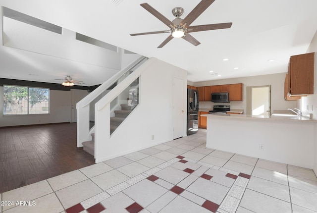 interior space with light wood-type flooring and ceiling fan