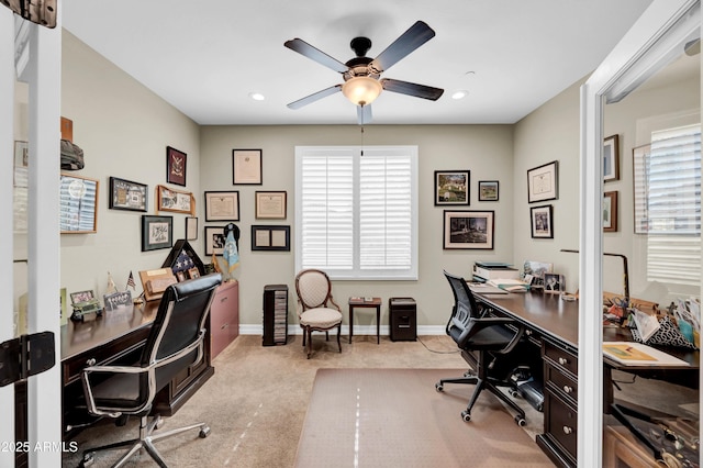 office featuring ceiling fan and light colored carpet