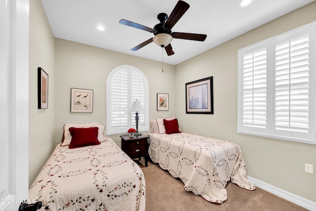 bedroom with ceiling fan and carpet flooring