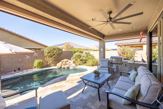 view of patio with pool water feature, area for grilling, ceiling fan, an outdoor living space, and a fenced in pool