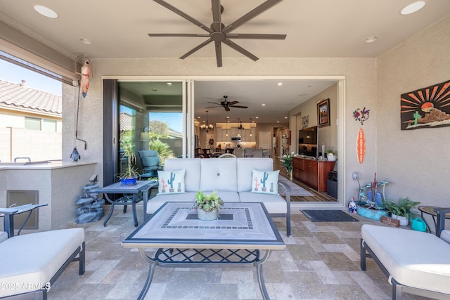 view of patio / terrace featuring ceiling fan and outdoor lounge area