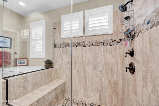 bathroom with tiled shower