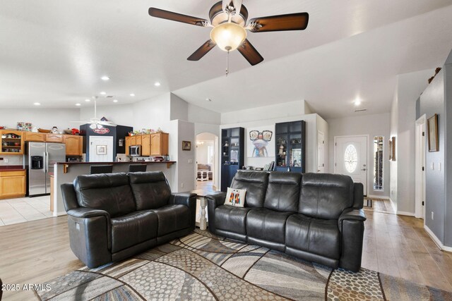 7300 Butte Vis, Prescott Valley, AZ 86315 - living area featuring light wood-style flooring, ceiling fan, recessed lighting, arched walkways, and lofted ceiling