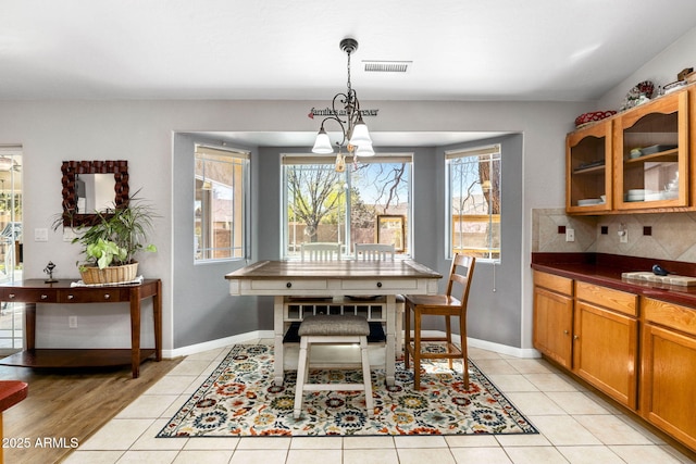 7300 Butte Vis, Prescott Valley, AZ 86315 - dining space with light tile patterned flooring, baseboards, visible vents, and a chandelier