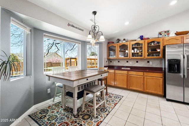 7300 Butte Vis, Prescott Valley, AZ 86315 - dining space featuring vaulted ceiling, baseboards, a chandelier, light tile patterned flooring, and visible vents