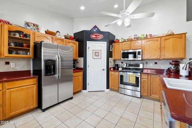 7300 Butte Vis, Prescott Valley, AZ 86315 - kitchen with light tile patterned flooring, a sink, appliances with stainless steel finishes, dark countertops, and ceiling fan