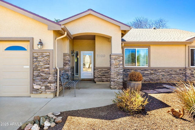 7300 Butte Vis, Prescott Valley, AZ 86315 - entrance to property featuring stucco siding, an attached garage, and stone siding
