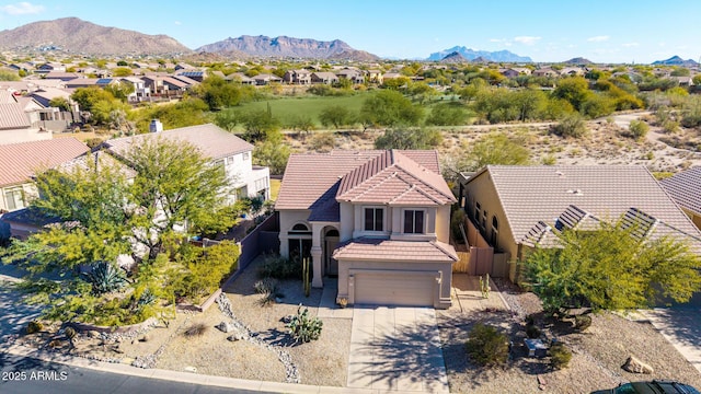 birds eye view of property featuring a mountain view