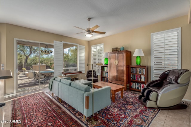 tiled living room featuring ceiling fan