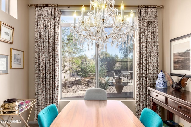 dining space with a notable chandelier