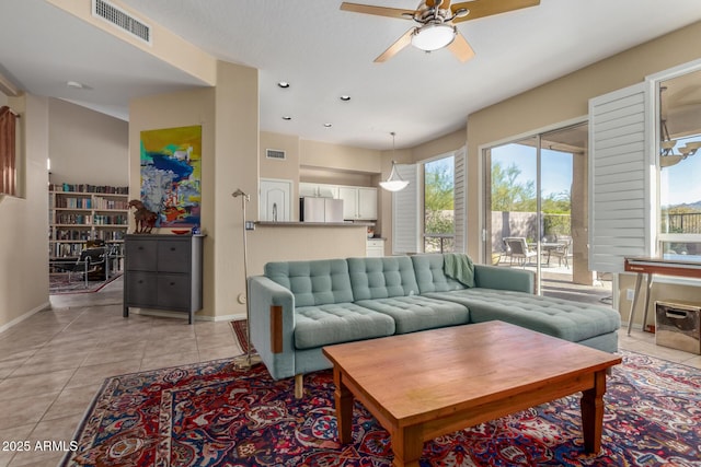 living room featuring ceiling fan and light tile patterned floors