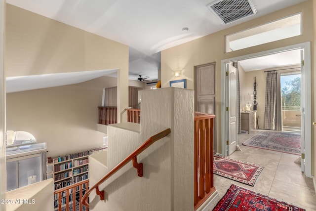 stairway featuring tile patterned floors