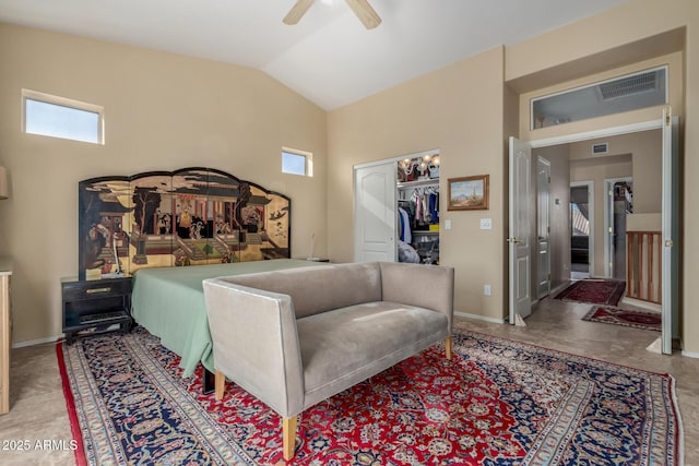 bedroom with ceiling fan, lofted ceiling, and a closet