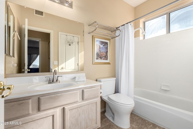 full bathroom featuring vanity, tile patterned floors, toilet, and shower / bath combo with shower curtain