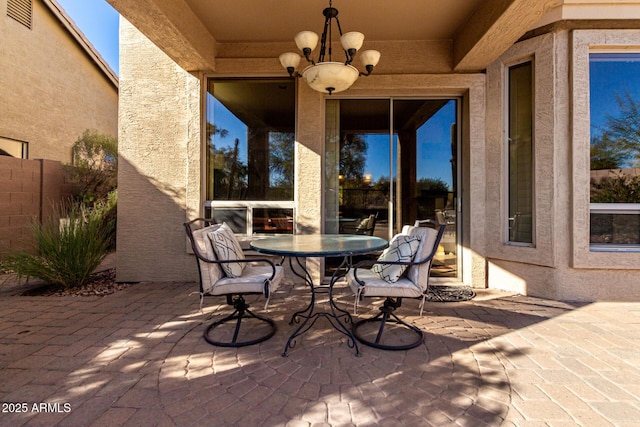 view of patio / terrace featuring ceiling fan