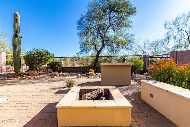 view of patio / terrace with an outdoor fire pit