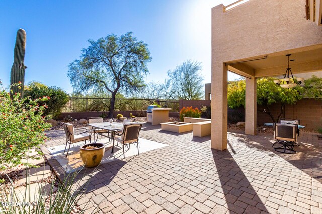 view of patio featuring an outdoor fire pit