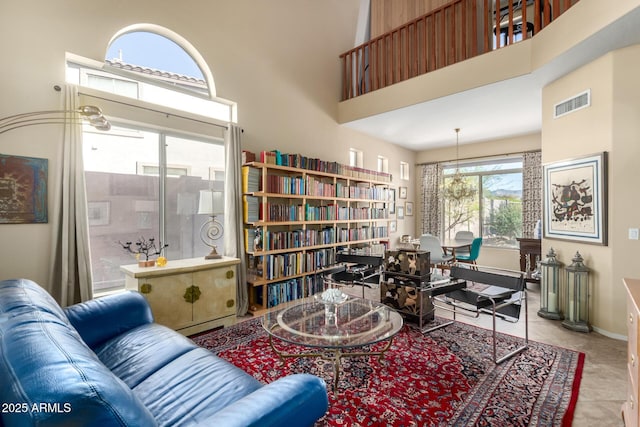 living area with a high ceiling